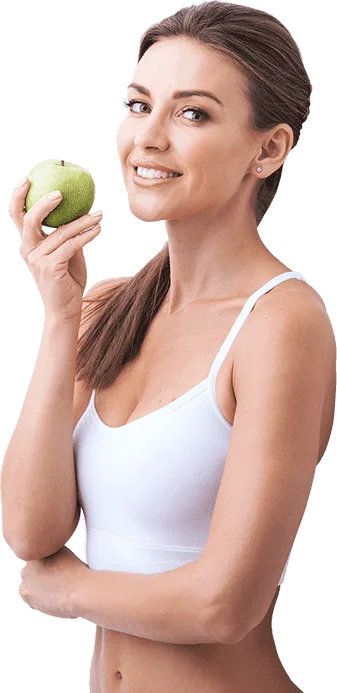 Mujer en forma con manzana verde mostrando cintura plana — resultado con Turboslim cápsulas para bajar de peso